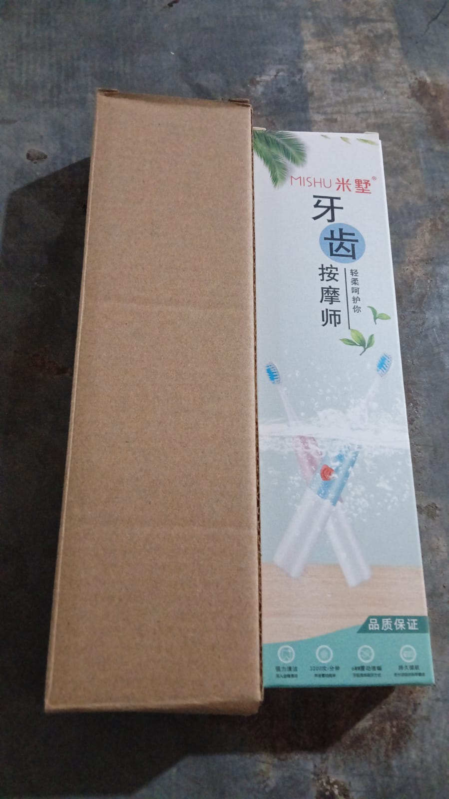 Hand holding the slim Battery-Operated Electric Toothbrush for daily use.