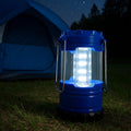 Portable camping lantern with handle, ready for outdoor adventures.