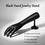 Palm side of black hand-shaped jewelry organizer stand