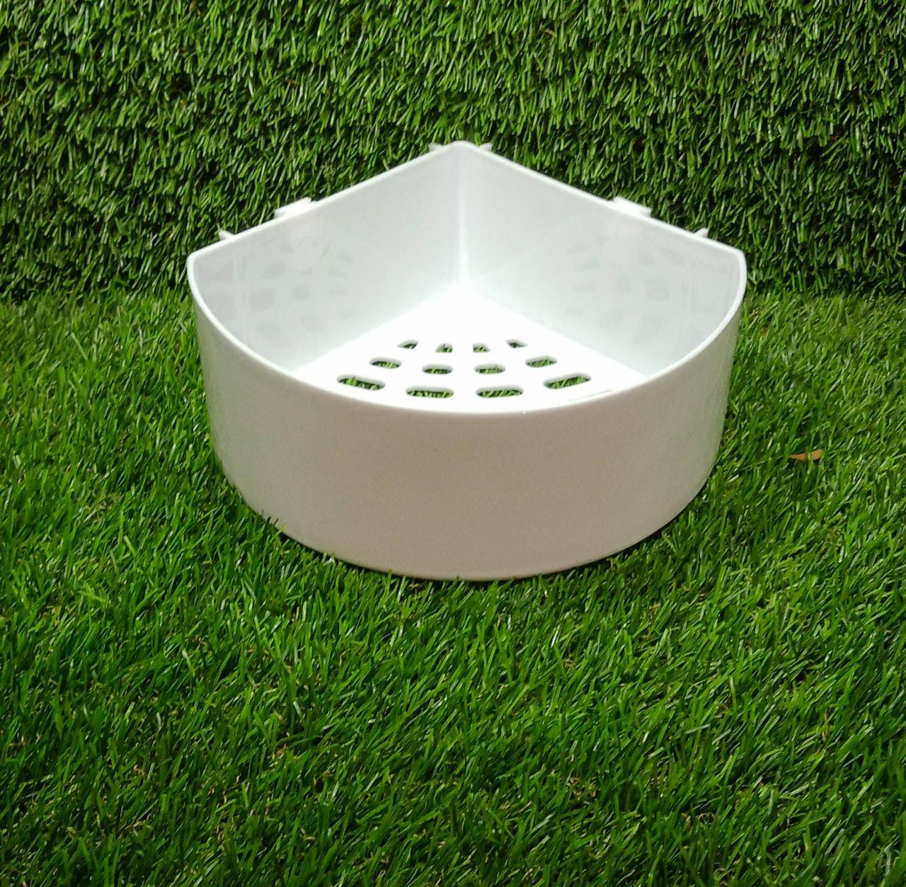 Empty triangle wall mount storage basket ready for use.