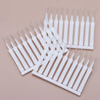 The shower head cleaning brush set displayed with a focus on its ergonomic handle.
