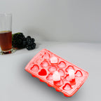 Heart-shaped ice cubes floating in a refreshing drink, adding a lovely touch.