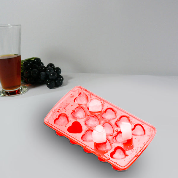 Heart-shaped ice cubes floating in a refreshing drink, adding a lovely touch.