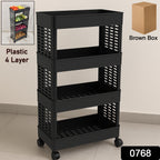A versatile plastic utility organizer trolley with wheels, used in a modern kitchen setting.