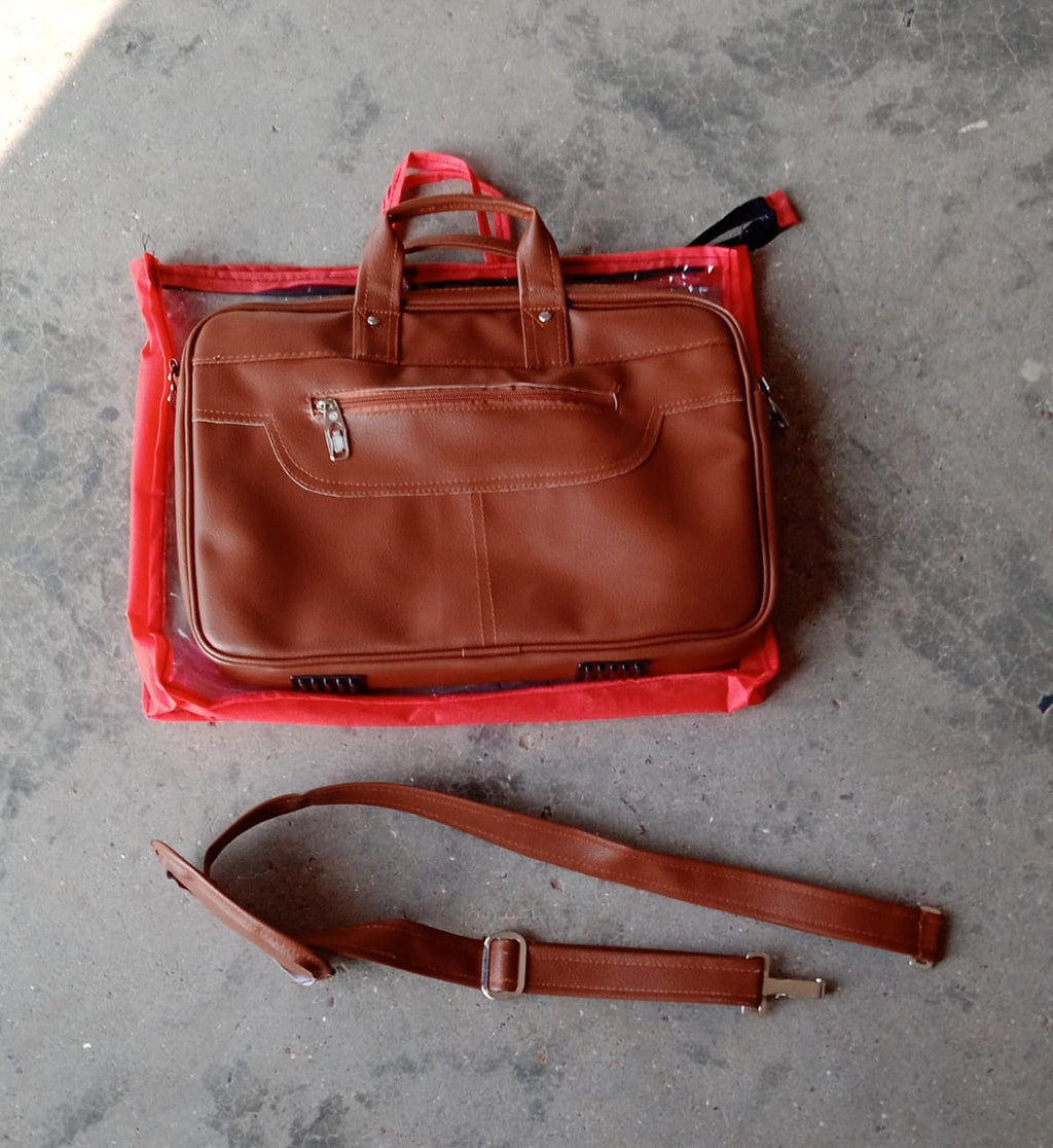 Faux leather messenger bag open with a laptop and other daily essentials neatly arranged inside.
