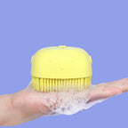 Front view of a soft silicone bath brush with integrated shampoo dispenser.