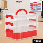 Stacked multi-compartment transparent storage carry box showing all layers