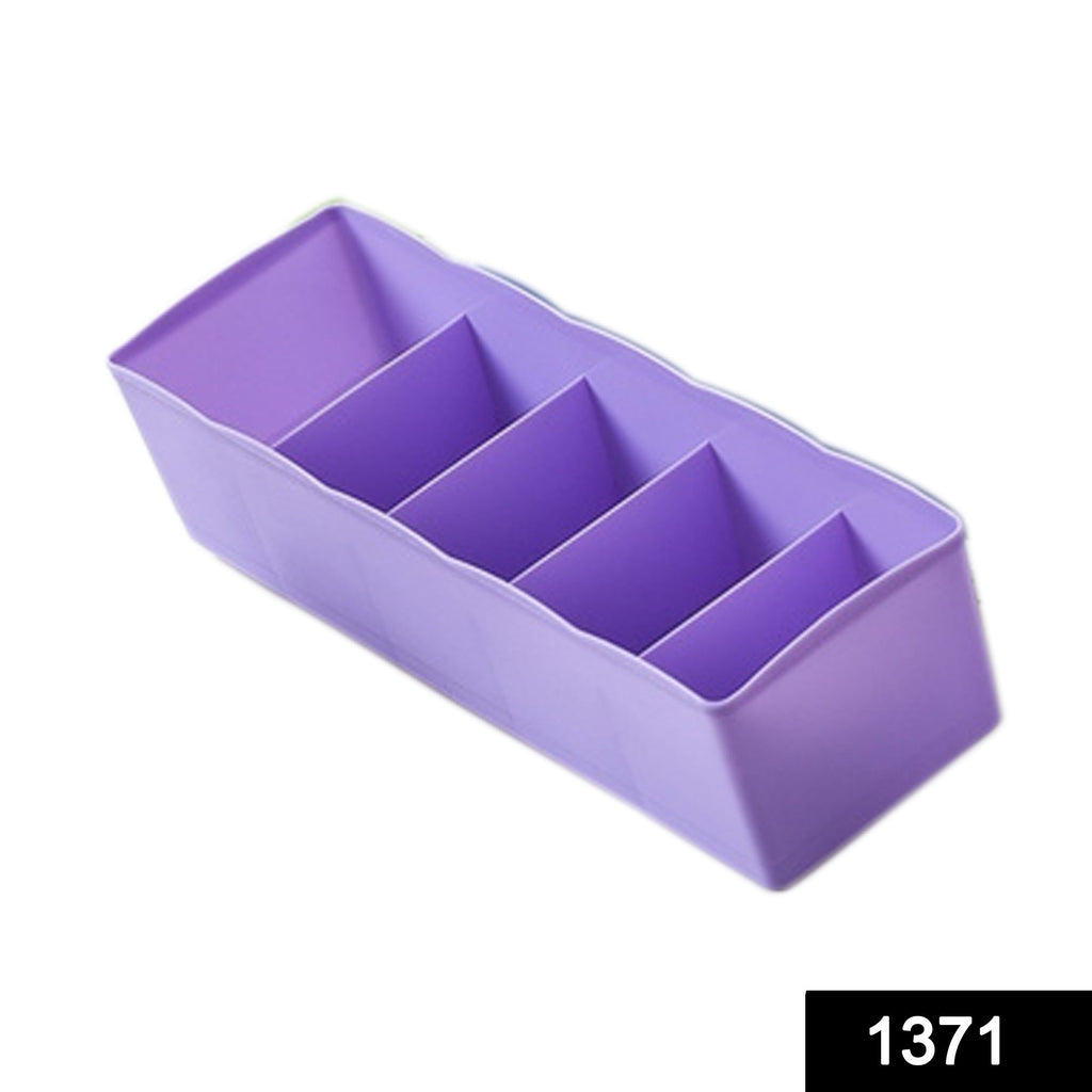 Transparent plastic storage tray with fixed dividers, ideal for organizing small accessories.
