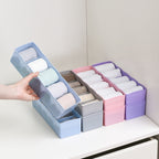 Clear plastic organizer tray with multiple compartments for beads and small craft items.