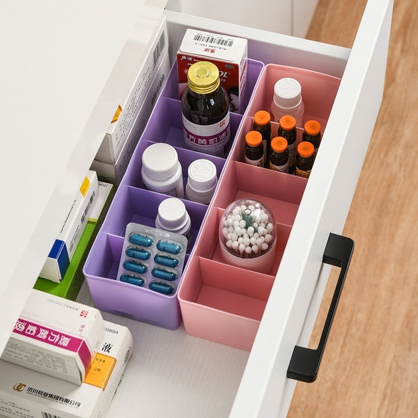 Overhead view of a clear plastic organizer filled with vibrant small craft beads.