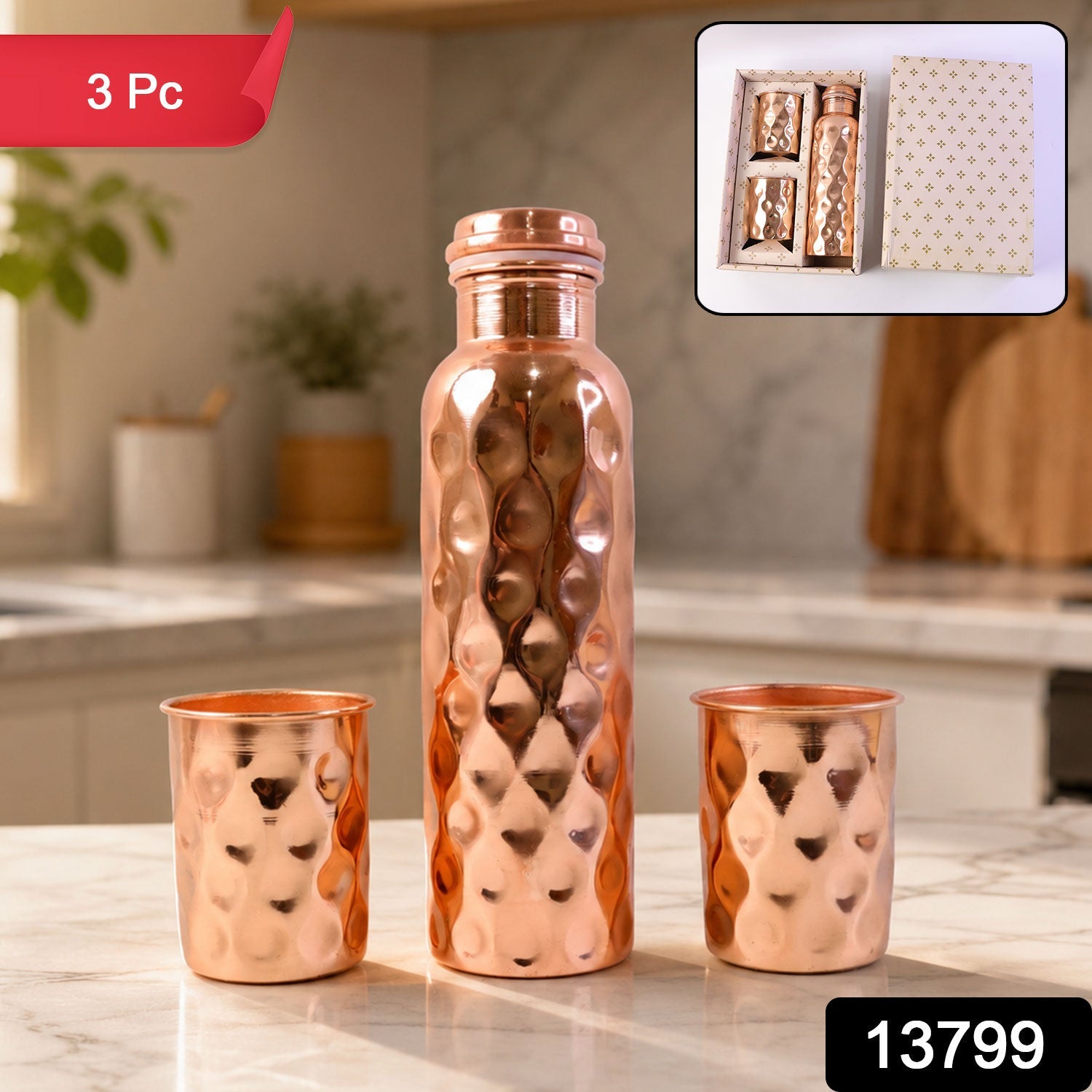 The elegant copper water bottle and two glasses, presented as a thoughtful gift set.