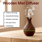 The small footprint of the Mini Wooden Humidifier shown with other items for scale.