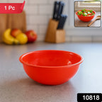 Red plastic bowl ideal for mixing and serving a variety of foods