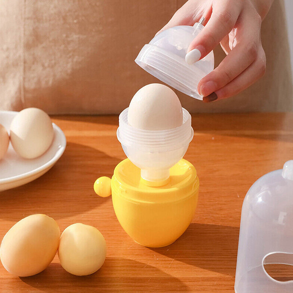 Hand holding a white Manual Egg Scrambler, demonstrating its compact size and ergonomic design.