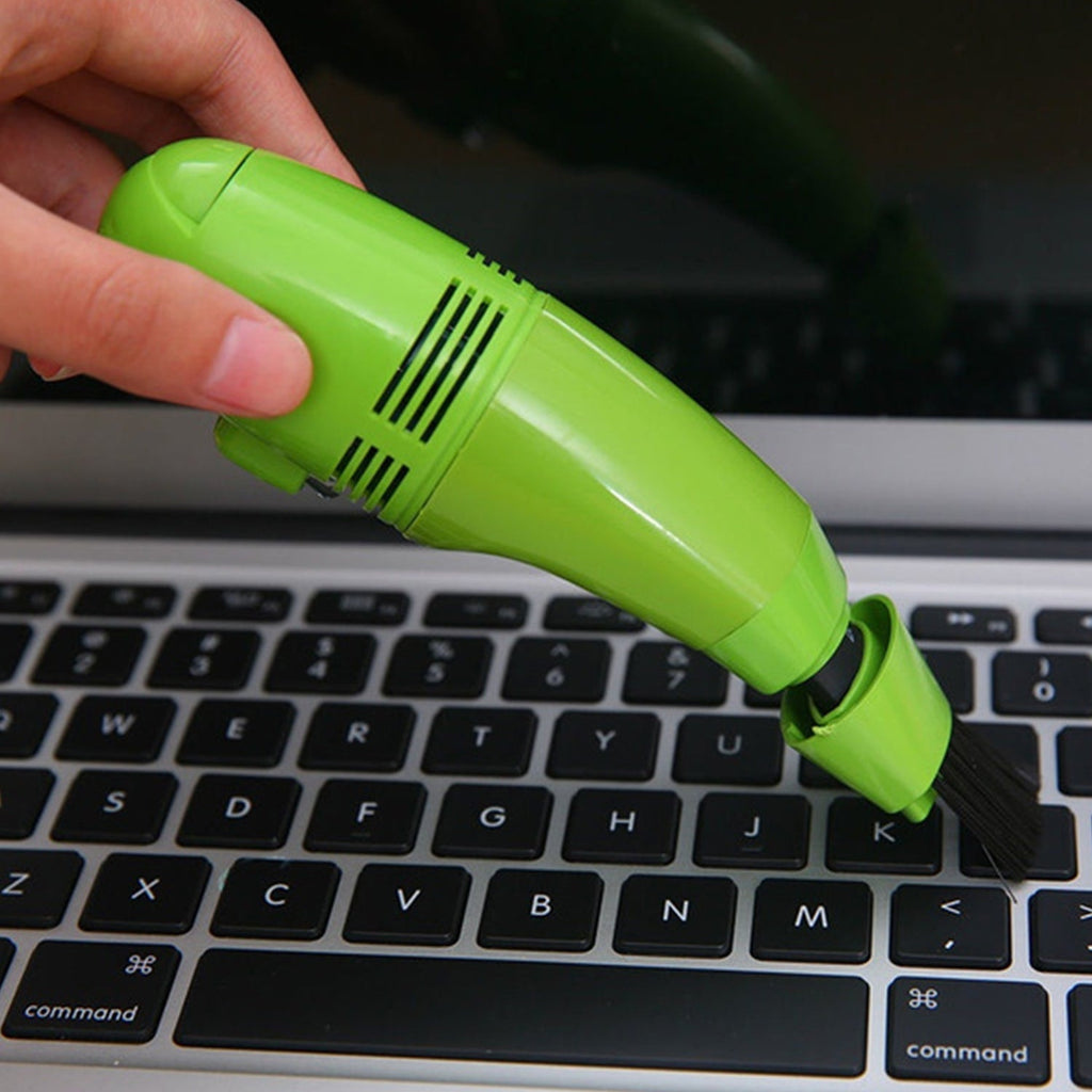 Compact USB mini vacuum cleaner for precise cleaning of keyboards and car interiors.