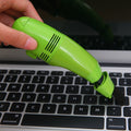 Compact USB mini vacuum cleaner for precise cleaning of keyboards and car interiors.