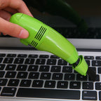 Compact USB mini vacuum cleaner for precise cleaning of keyboards and car interiors.