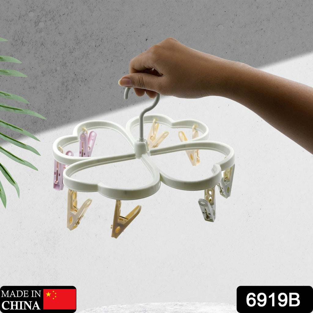 Compact clip hanger for drying delicates and baby clothes.