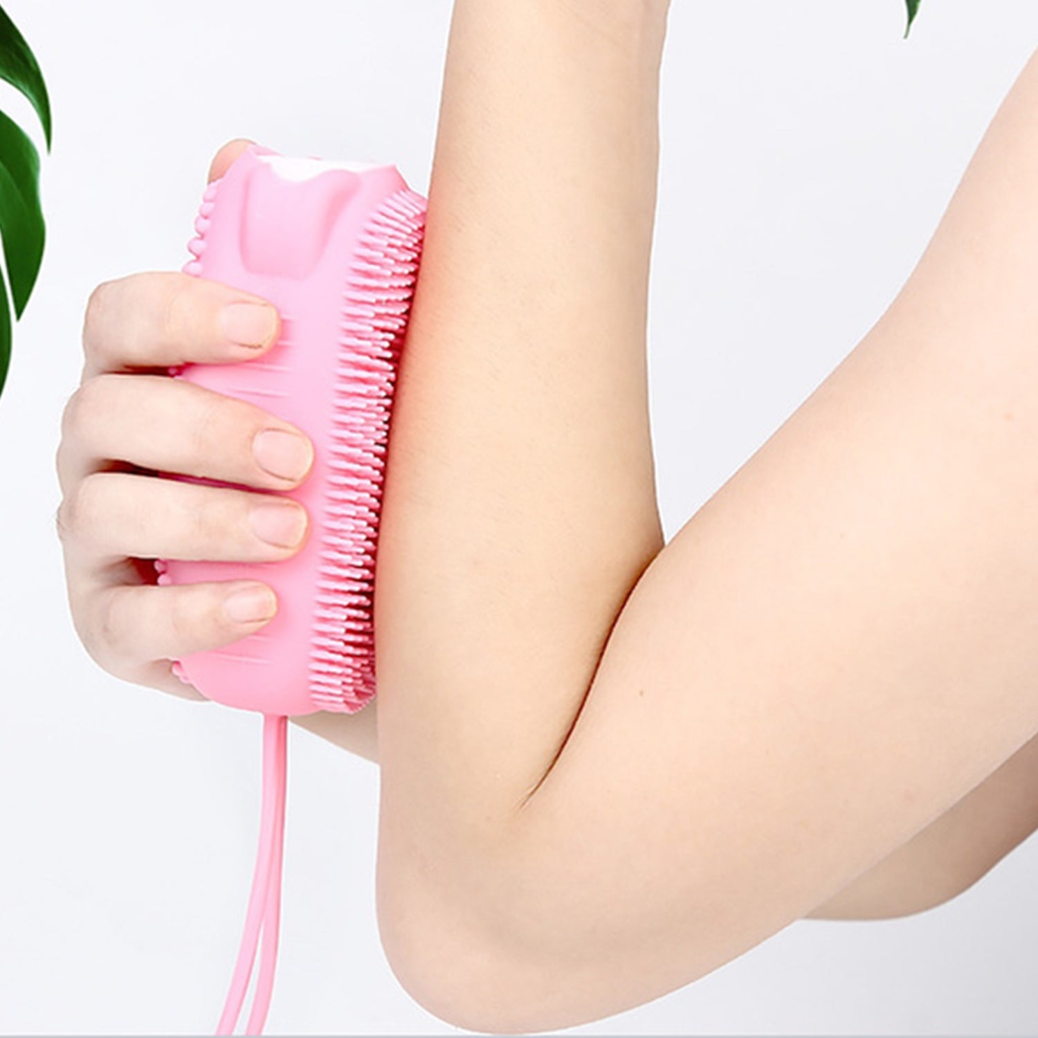 Soft silicone body scrubber in a bubble bath, showing its gentle bristles.