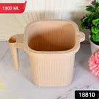 Transparent Plastic Bath Mug with a sturdy handle, ideal for daily use.