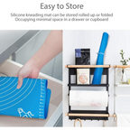 Silicone baking mat laid flat on a surface, showing its full size and flexibility.