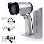Easy-to-install dummy security camera with a visible flashing light, ideal for deterring intruders.
