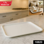 Plastic serving tray holding coffee cups and snacks
