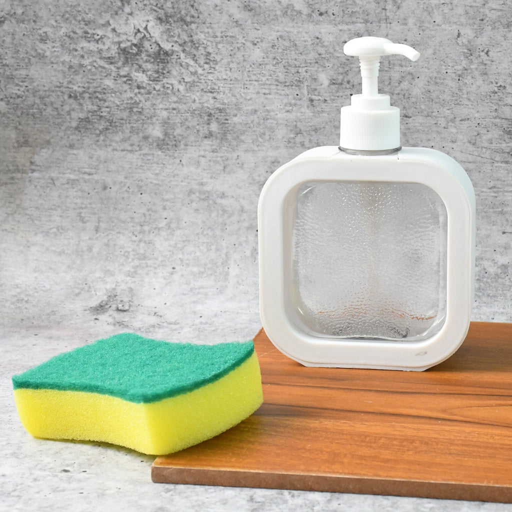 Detailed view of the transparent body of the refillable soap dispenser.
