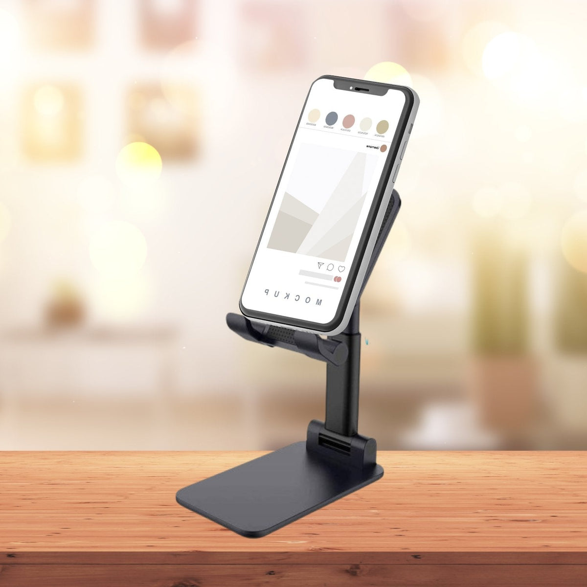 PHOBIA Foldable Mobile Stand in black, ready for use on a desk.