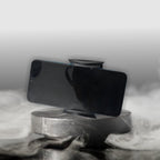Close-up of a smartphone attached to the anti-fall car phone holder on an air vent.