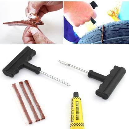 RaceVault tubeless tyre repair kit with T-handle tools and rubber cement.