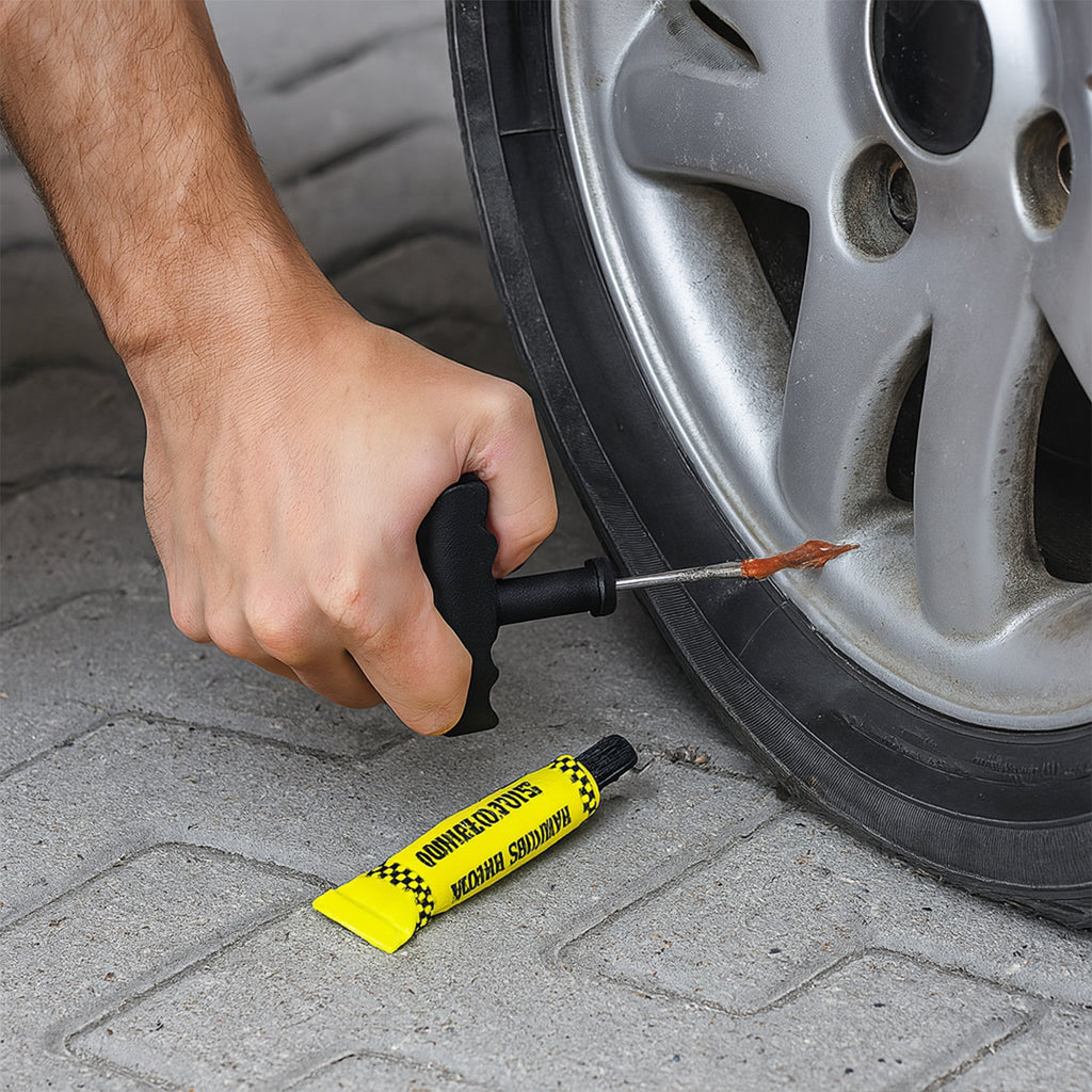 All 5 pieces of the tubeless tyre puncture repair kit laid out on a clean surface.