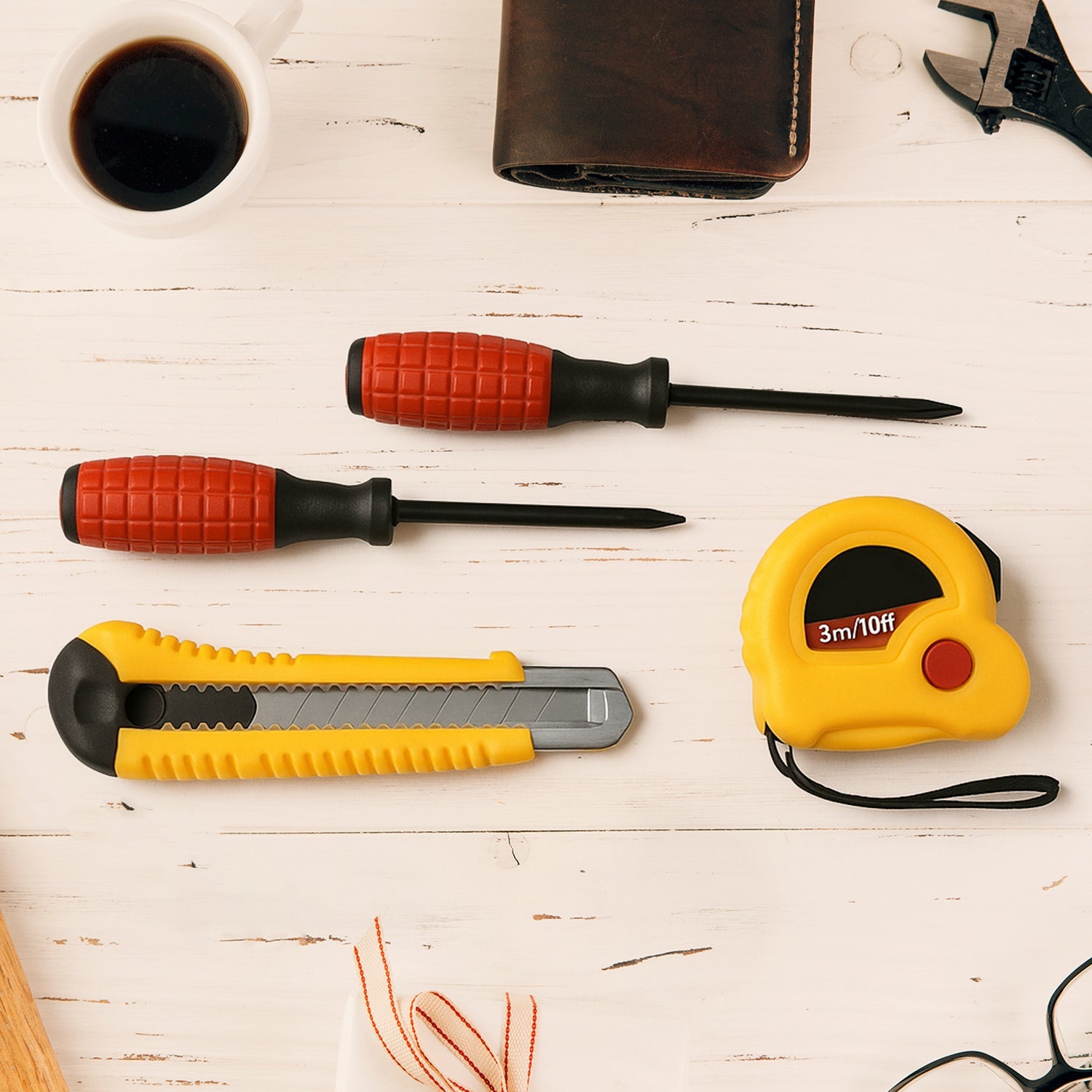 Compact 4 in 1 hand tool kit with tape measure, screwdriver and cutter for home repairs