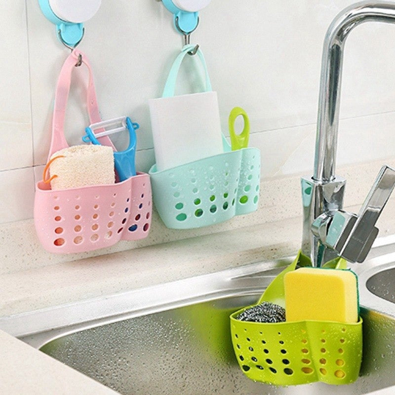 Adjustable plastic faucet sink caddy in a modern kitchen.