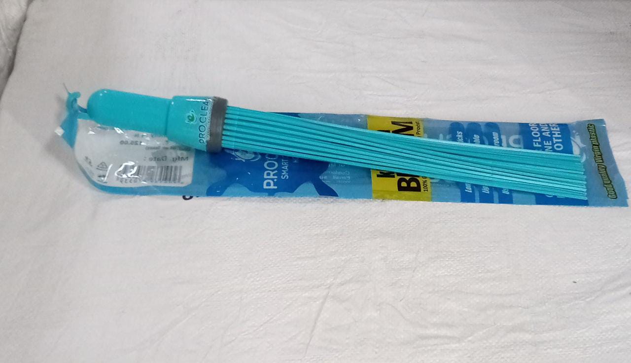 Straight view of the Pro Clean plastic broom, showcasing its sturdy handle and bristles.