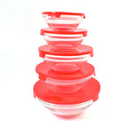 Overhead shot of the Organivo 5-piece glass bowl set, showing the clear glass and red lids.
