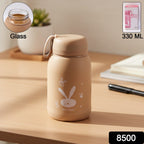 Side view of bunny print glass water bottle showcasing its compact design