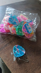 Bright background showcasing the playful nature of mini fidget keychains.