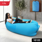 Person lounging on portable inflatable air sofa during outdoor activity