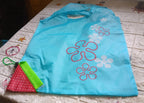 Different colors of washable and foldable reusable grocery bags, ready for heavy loads.