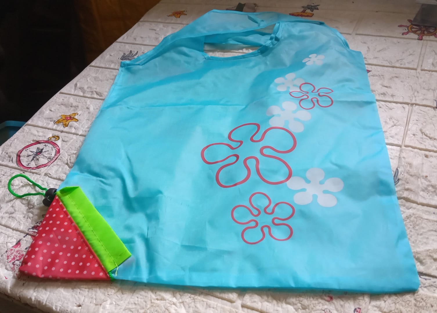 Different colors of washable and foldable reusable grocery bags, ready for heavy loads.