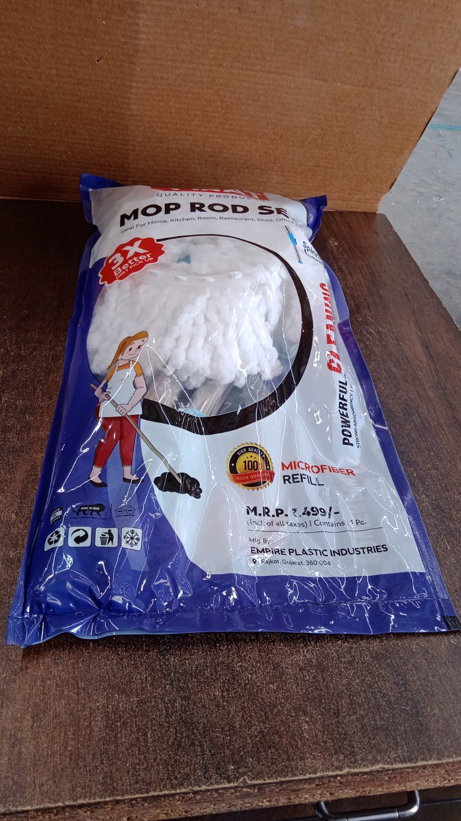 Packaged adjustable stainless steel mop rod with microfiber head set ready for assembly