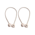 Non-magnetic pearl curtain tiebacks in use, adding a touch of elegance to living room decor.