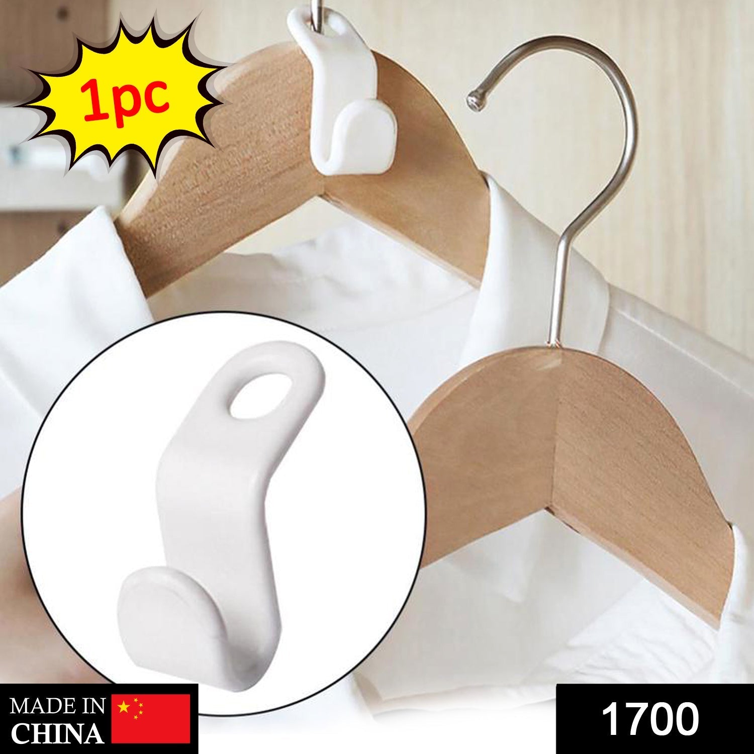 Close-up of a single white plastic hanger connector hook.