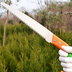 Close-up of the sharp high-carbon steel blade of the tree pruning saw.
