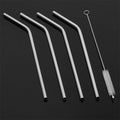 Set of four bent Stainless Steel Straws with a cleaning brush on a clean surface.
