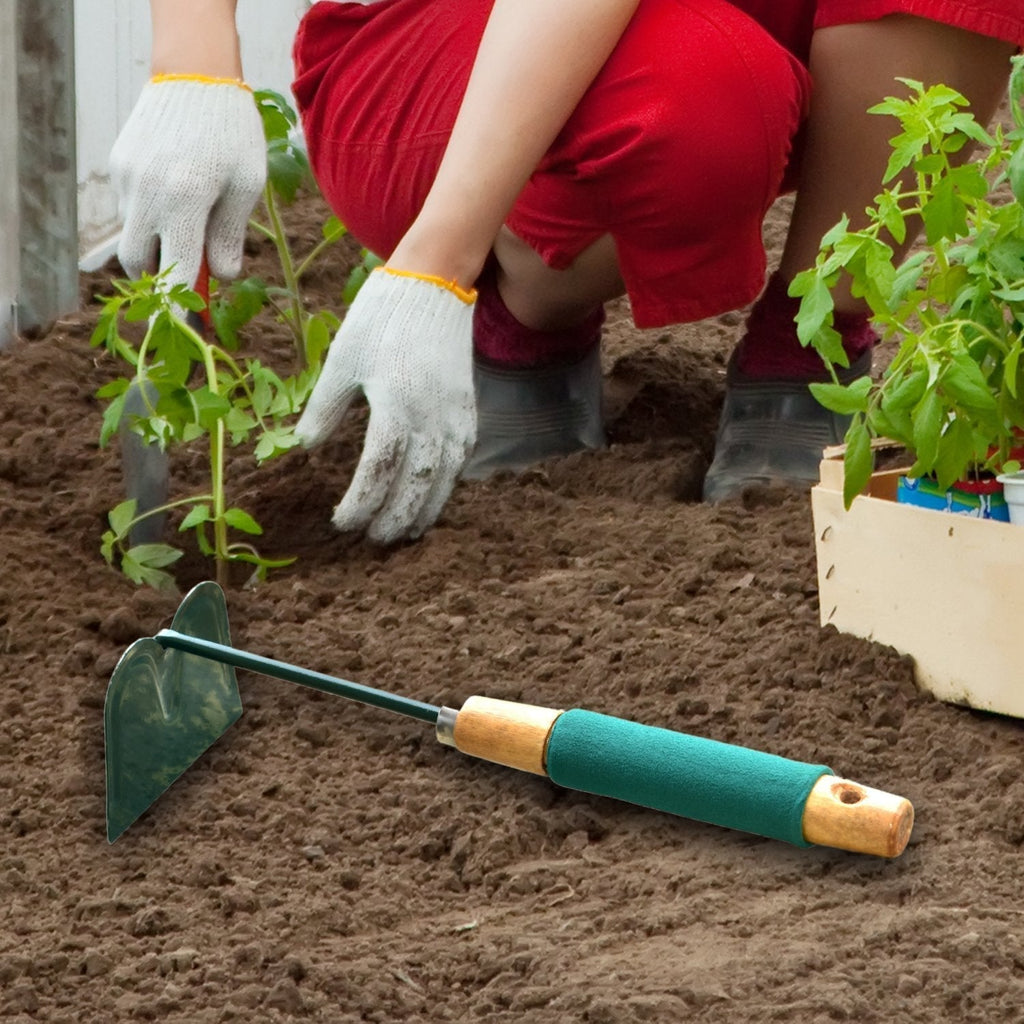 Close-up of the robust carbon steel gardening hoe, ready for tough garden tasks.