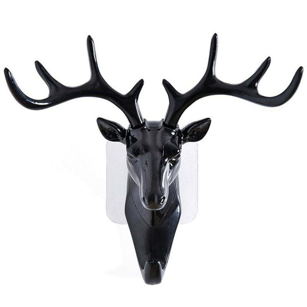 White deer head self-adhesive wall hook attached to a door, ready for use.