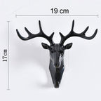 Stylish deer head hook in grey, functioning as a decorative hanger for a hat.