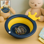 Foldable baby wash basin with a cheerful cartoon design, open and ready for use.